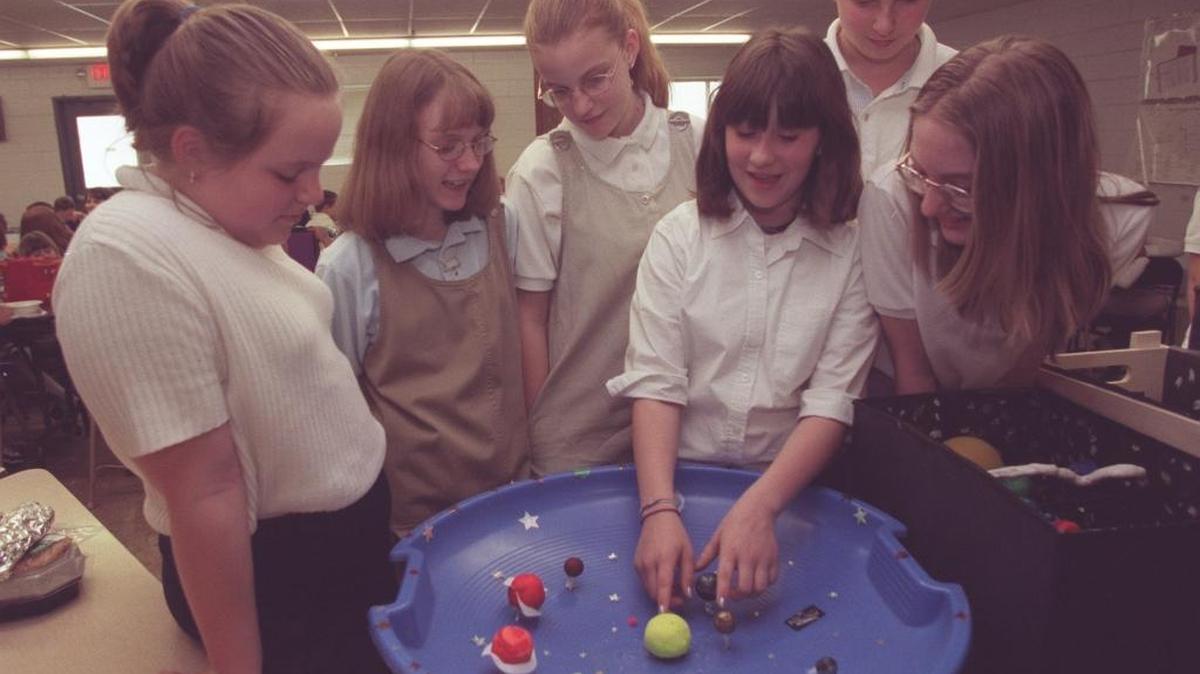 Blue Grass Baptist School students showed a 3-D model of the solar system that they had made in 2000. The board plans to close the school at the end of this school year.