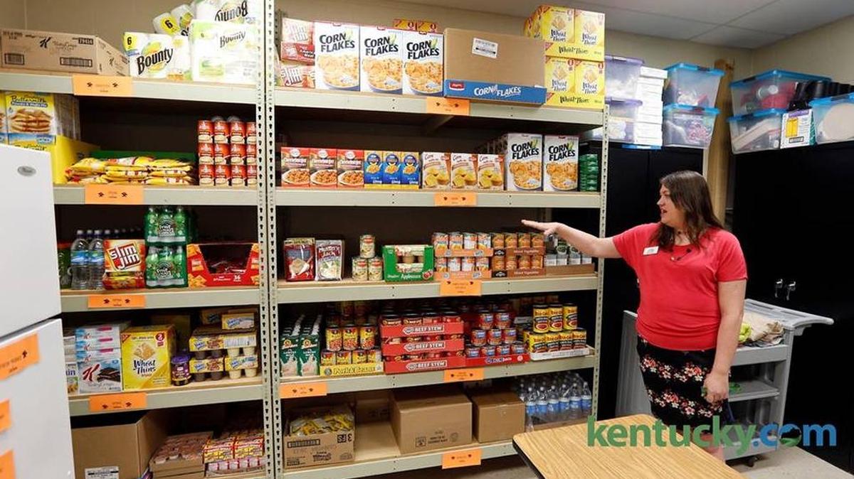 Sabina Massey, youth service coordinator, in the food pantry at Bryan Station High School in May 2015. The school started the food pantry to help homeless students and students in need. They also provide clothing and other household and personal items.