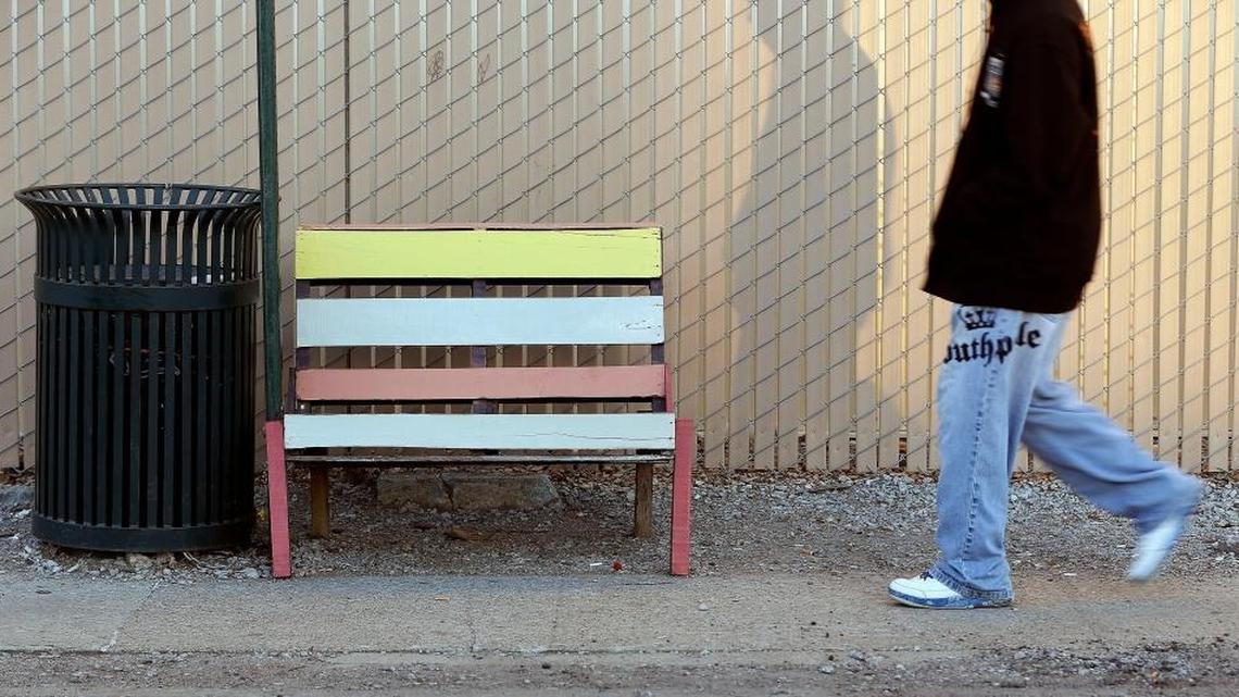 A man walked past one of the homemade benches at the LexTran bus stop in the 700 block of North Limestone. LexTran doesn't know who has been putting the benches at some of its bus stops.