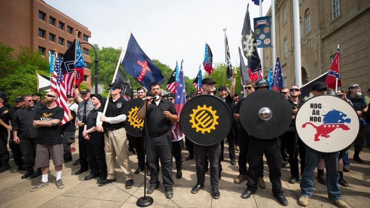 Matthew Heimbach, head of the Traditionalists Worker Party, center, speaks during a white nationalist rally in downtown Pikeville, Ky., Saturday, April 29, 2017.