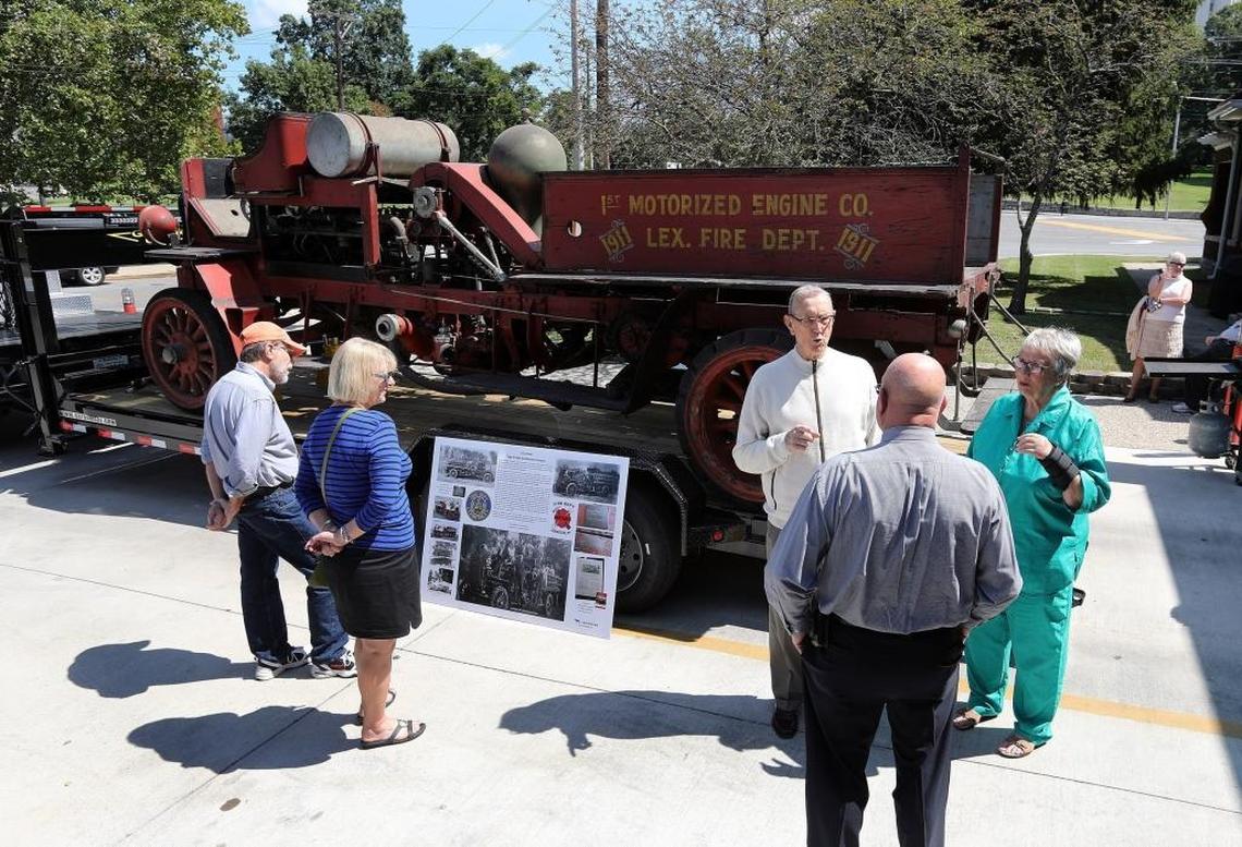 Ret. Maj. Orville Cook and his wife Mattie visited with a friend in front of a vintage city fire engine from 1911, one of 4 remaining in the world.