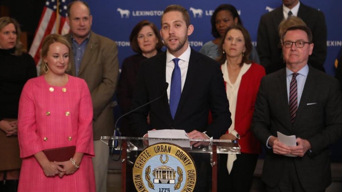 Lexington attorney Preston Worley spoke Thursday after being sworn in as the 7th District member of the Urban County Council. Worley was appointed by Mayor Jim Gray, right, to fill Jennifer Scutchfield’s seat.