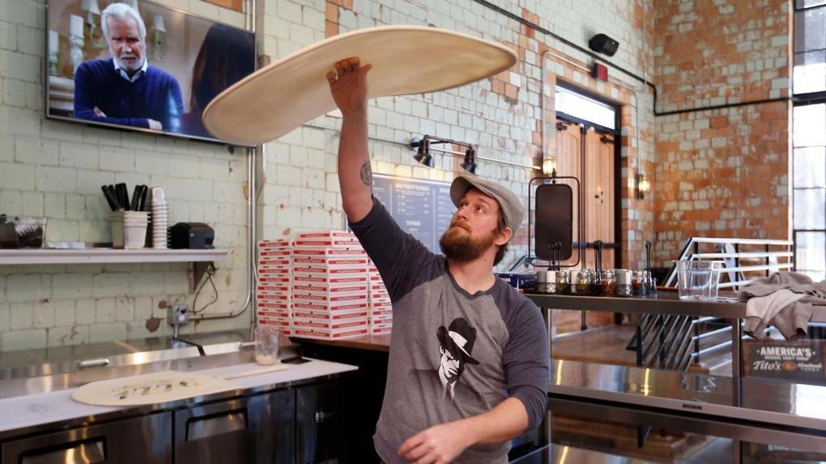 Jimmy Gadd tossed a 22-inch pizza crust Thursday in the new Goodfellas Distillery on the Pepper Distillery campus off Manchester Street in Lexington. The new place, opening Saturday, will sell pizza by the slice and whole pies for lunch and dinner.
