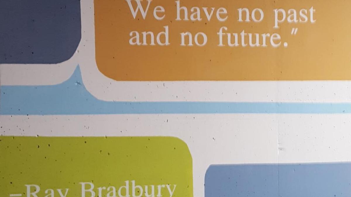 A wall at the downtown public library parking lot on Water Street was covered with a Ray Bradbury quote by Bryan Station High School student Xavier Short.