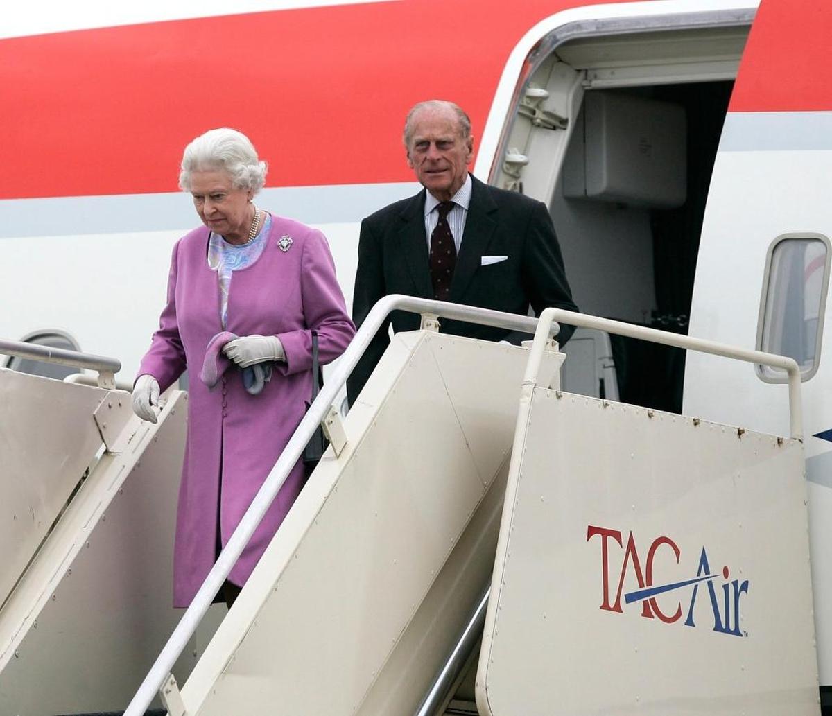 In this 2007 file photo, Queen Elizabeth II and her husband, Prince Philip, Duke of Edinburgh, walked down the stairs they arrived at the Blue Grass Airport in Lexington on May 4 to watch the Kentucky Derby.