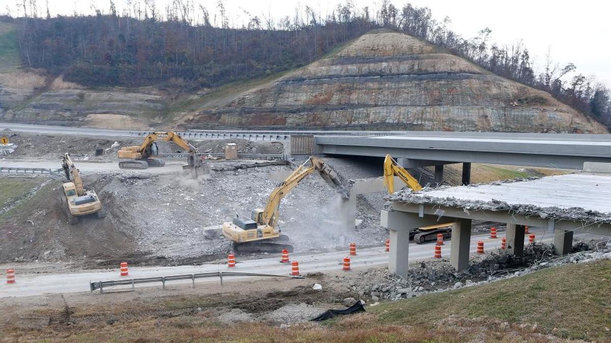 An old overpass in demolished over Ky. 30 as part of the Mountain Parkway expansion project near Salyersville, Ky., Thursday, November 3, 2016. From the Kentucky Transportation Cabinet, "The Mountain Parkway Expansion is a 46-mile transportation improvement project that will create a wider, safer connection between Eastern Kentucky and the rest of the Commonwealth. It is a key transportation project designed to close the only gap in a 400-mile, four-lane, high-speed corridor for commerce and mobility across Kentucky from Pikeville to Paducah. The project will widen 30 miles of the existing parkway to four lanes and extend the parkway by about 16 miles between Salyersville and Prestonsburg."