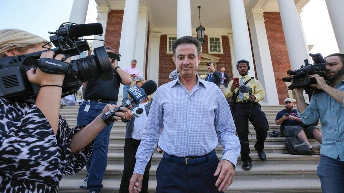 Rick Pitino left a meeting Wednesday at the University of Louisville with interim president Greg Postel.