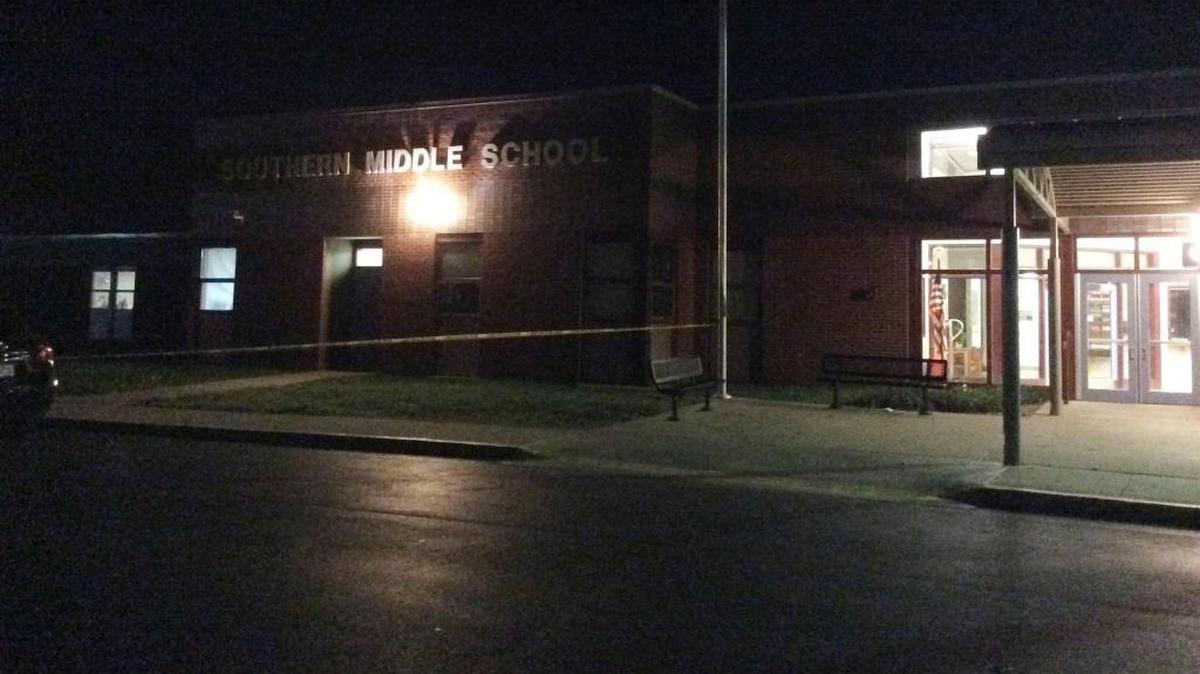 Police tape was up in front of Southern Middle School after a shooting in the parking lot during a football game.