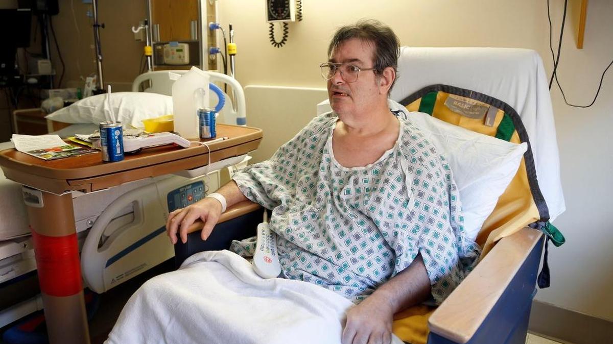 Jerry Ginter in his hospital room at the University of Kentucky Albert B. Chandler Hospital on Dec. 3. Ginter, who has cerebral palsy, has been at UK since Oct. 30 after chest pains and a stomach virus sent him to the ER from a nursing home in Carroll County.