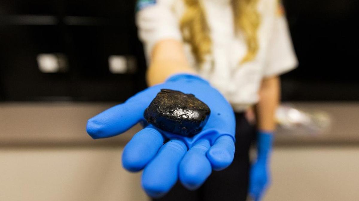 In this Jan. 27, 2016, photo, 39.6 grams of black tar heroin, with a street value of about $12,000, are among many other heroin-related items in Post Falls Police Department’s evidence room in Post Falls, Idaho.