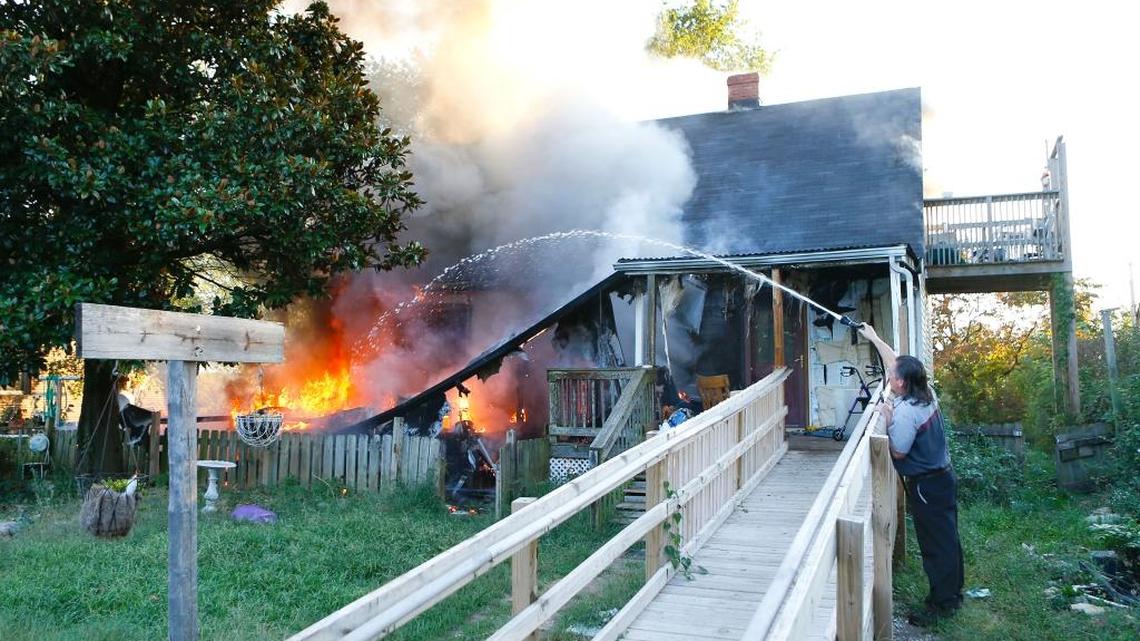 William Smith, who was passing by when he saw the fire, put water on the burning house at 3158 Leestown Road in Lexington on Sept. 18, 2015. Occupant Clarence Woodrum was rescued from his second floor balcony by Smith and another man. Smith saw the fire and stopped to help rescue Woodrum and then put water on the fire until firefighters arrived. The fire department also rescued several of Woodrum’s dogs and gave them oxygen before returning them to Woodrum.