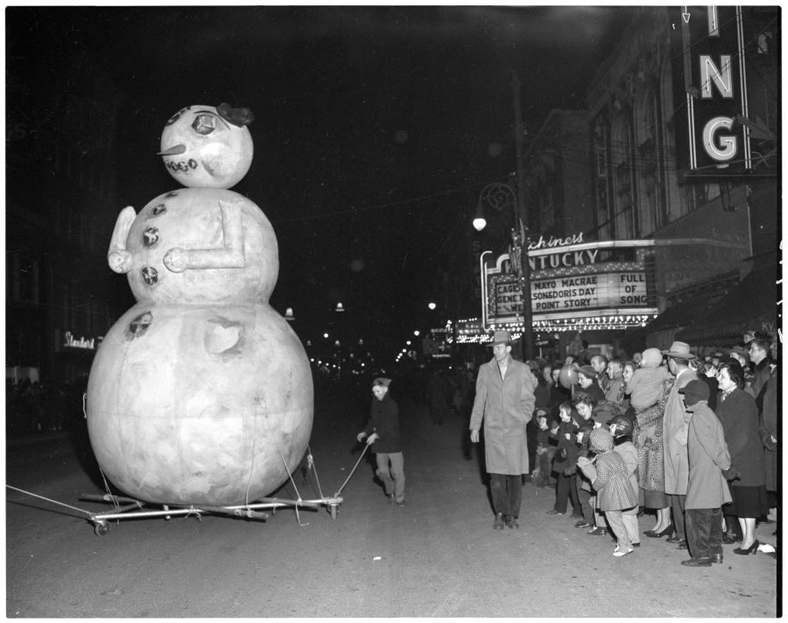 A snowman float makes its way down Main Street during the Dec. 4, 1950 Christmas parade in Lexington. In the background is the marquee for the Kentucky Theater.