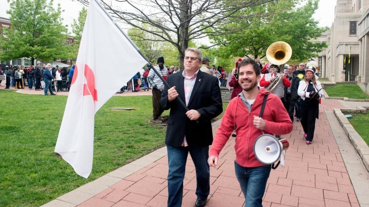 Jon Parker, Executive Director of AVOL Lexington, and Michael Birchett, AVOL Lexington Board of Directors President, lead the AIDS Walk for Life 25 at Stephens Courthouse Plaza in Lexington, KY on Sunday, April 23, 2017.
