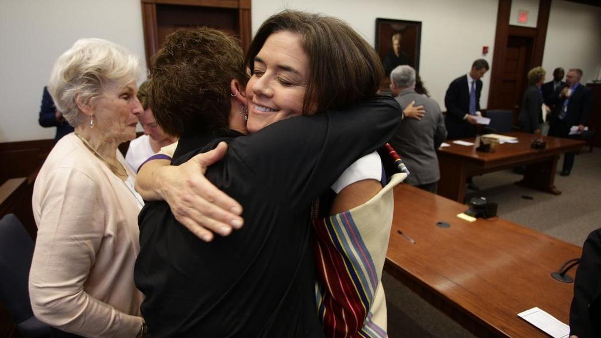 Lou Anna Red Corn hugged family and friends after she was sworn in as Fayette Commonwealth’s Attorney on Monday, Oct. 3, 2016, in Lexington, Ky. She informed Gov. Andy Beshear that she will retire from the office on Sept. 30, 2022.