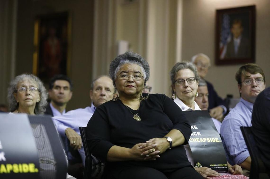 Marilyn Dishman, of Lexington, Ky., listens to remarks from councilman Kevin O. Stinnett ahead of a vote on a proposal to move two Confederate-era statues from downtown Lexington in council chambers at the Lexington-Fayette Urban County Government Center in Lexington, Tuesday, Aug. 15, 2017. The council voted 15-0 to pass the resolution.