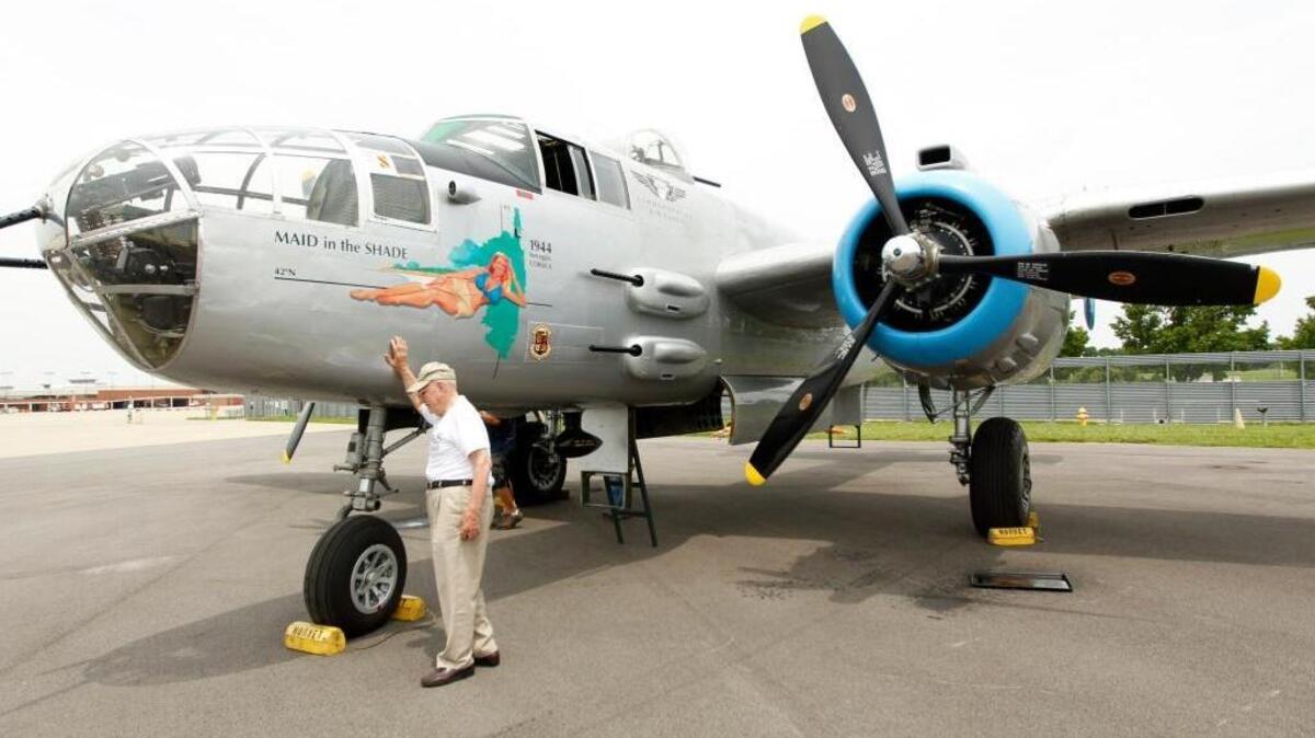 WWII veteran Jim Brown examined the WWII Bomber B-25 “Maid in the Shade” after a ride at Blue Grass Airport on July 8, 2013. Brown was the navigator on a B-17 with the 490th U.S. Army Air Corps Bomb Squadron, or the “Burma Bridge Busters.”