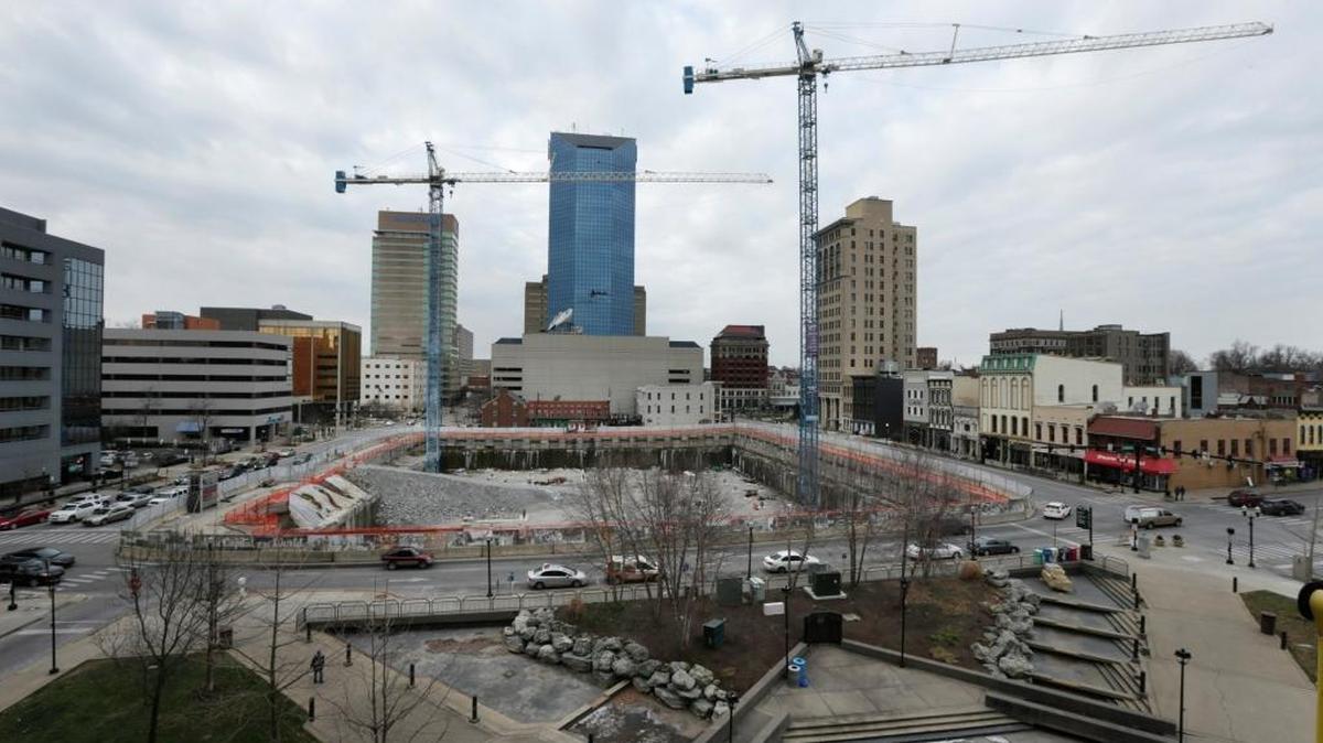 Traffic flowed past the chain link fences around the CentrePointe construction site.