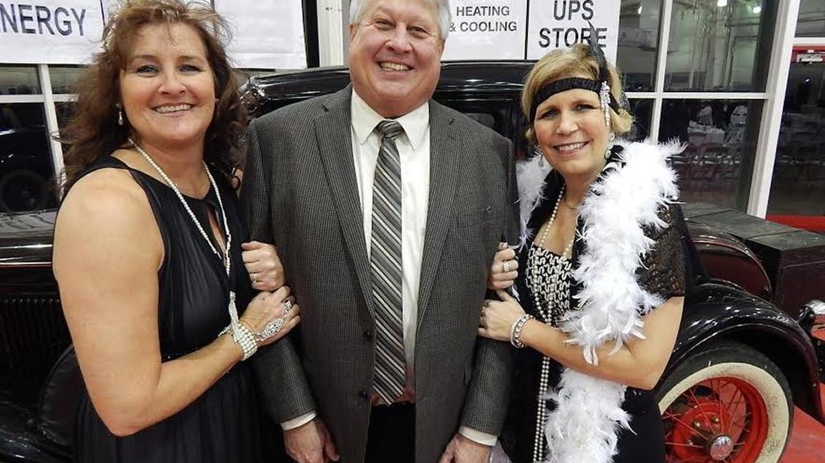 Jessamine County Chamber of Commerce Director Amy Cloud, left, with outgoing president Dave Carlstedt and newly installed president Ronda May at the chamber’s annual meeting and awards dinner held Jan. 28 at the R.J. Corman Hangar.