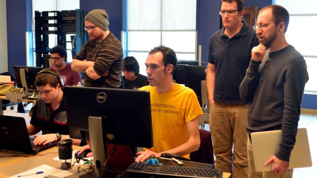 Michael Von, Tim Knowlton, Al Baker, and John Meister, of all Lexington, collaborate to finish the game “Midnight Munchies” at the Global Game Jam Competition sponsored by RunJumpDev and Bluegrass Community and Technical College on Sunday, January 31st, 2016 in Lexington, KY. Over 30 people participated locally in the Global Game Jam event along with over 20,000 others world-wide. All games are OpenSource and uploaded to Global Game Jam’s website to encourage the melding of ideas to form new games. This year’s theme “ritual” was released at 5:00 p.m. on Friday, Jan. 29, 2016.