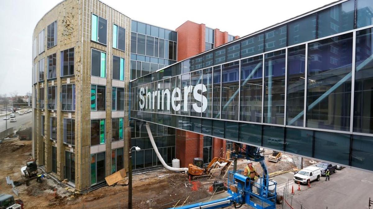 Darrell Simpkins, with Precision Wall Systems, worked Tuesday from a lift truck as construction continued on the new Shriners Hospitals for Children on South Limestone. The existing Shriners hospital on Richmond Road will be vacated when the five-story hospital opens.