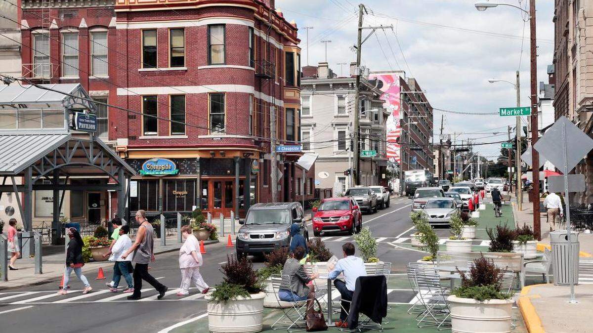 Diners sat in what used to be part of the road on West Short Street, where a pedestrian-friendly pilot project, targeted for the upcoming Breeders' Cup, was unveiled during a ribbon-cutting ceremony last month. The face lift includes benches, planters, wider walking areas and some angled parking spaces.