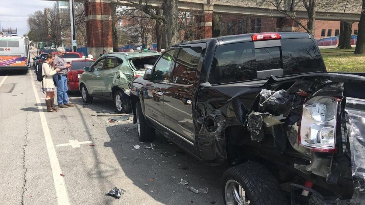 Five parked cars and trucks were hit by a Lextran bus on Limestone on Monday.