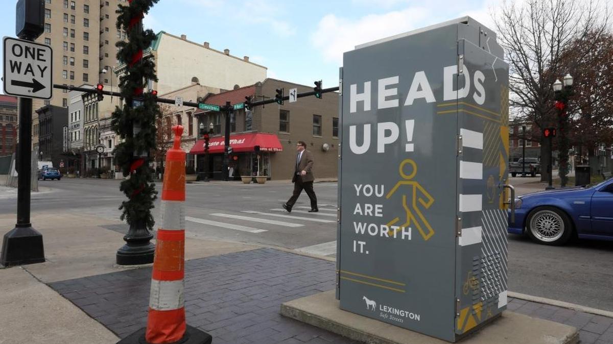This signal cabinet box located at the intersection of Main and Limestone is part of the city’s pedestrian safety campaign and features a logo and graphics designed by Bullhorn in Lexington, Ky., Thursday, December 14, 2017.