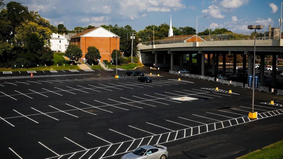 A car drives through the parking lot behind Main Street Baptist Church near the Jefferson Street Bridge in Lexington.