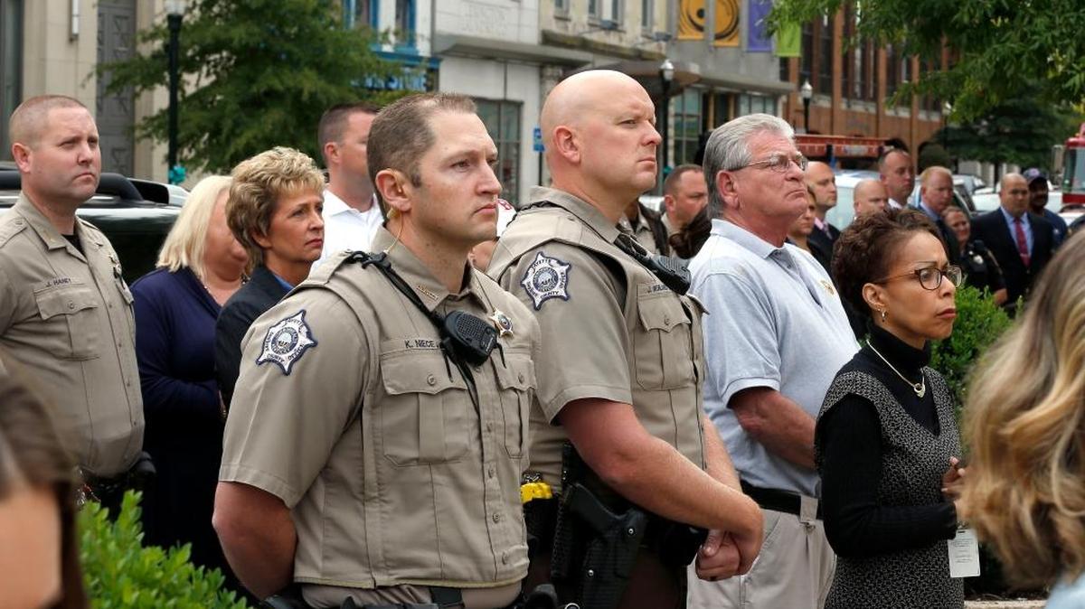 Fayette County Sheriff Kathy Witt, second from left, and some of her deputies, along with Judge Pamela Goodwine, right, attended the wreath-laying ceremony to commemorate a previous anniversary of the 9/11 attack of 2001.