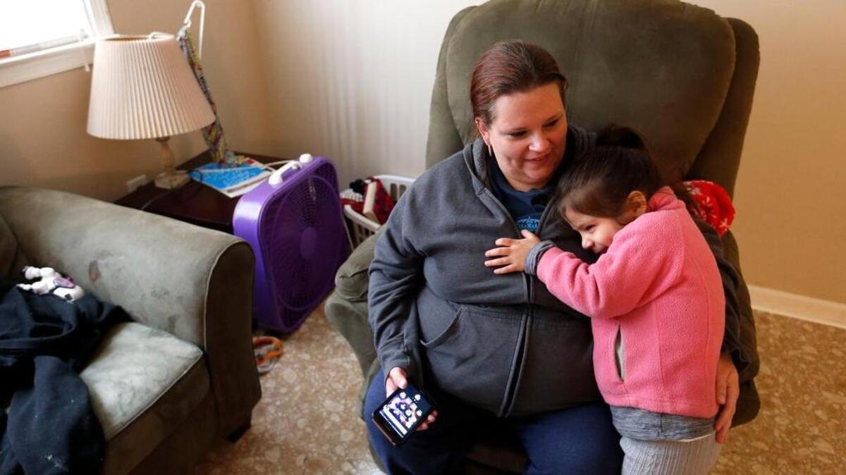 Jennifer Jimenez, with her 4-year-old daughter, Marcie Jimenez, said the temporary apartment provided throught the “Give Kids A Home” program provides stability for her family of five and gives her the chance to look for a full-time job.