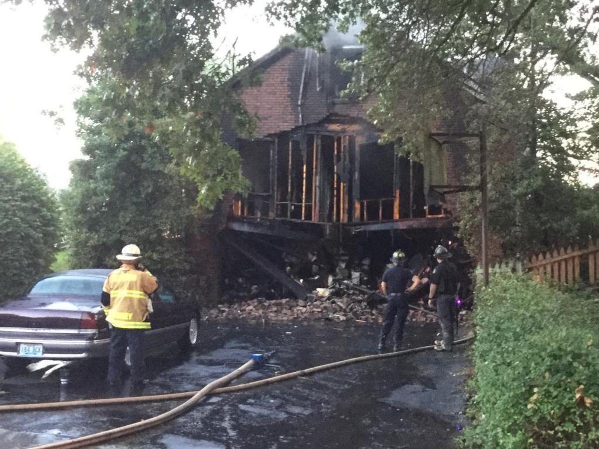 This house on Flintridge Drive in Lexington was heavily damaged by an early-morning fire Thursday. A woman was unaccounted for as of 8 a.m.