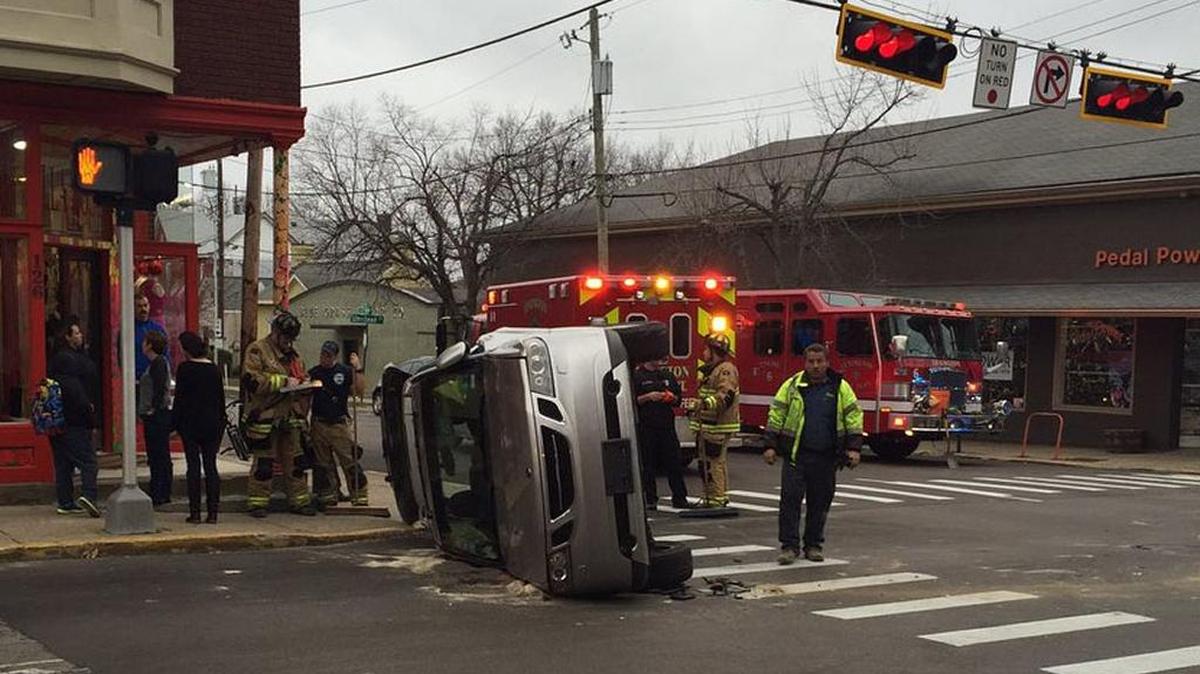 A car flipped onto its side during a crash at the corner of West Maxwell and South Upper streets in downtown Lexington.