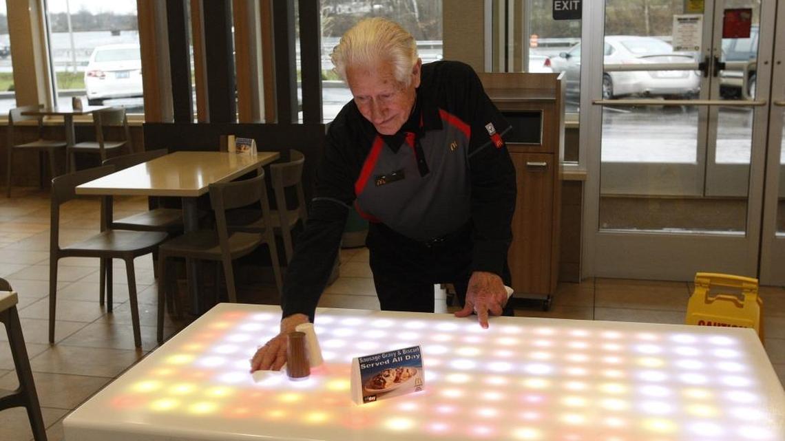 Wendall Gill, then 82, cleaned a table at McDonald’s on Richmond Road on Dec. 21, 2015. Gill still works at the restaurant. He recently lost his wife of 68 years, Della.