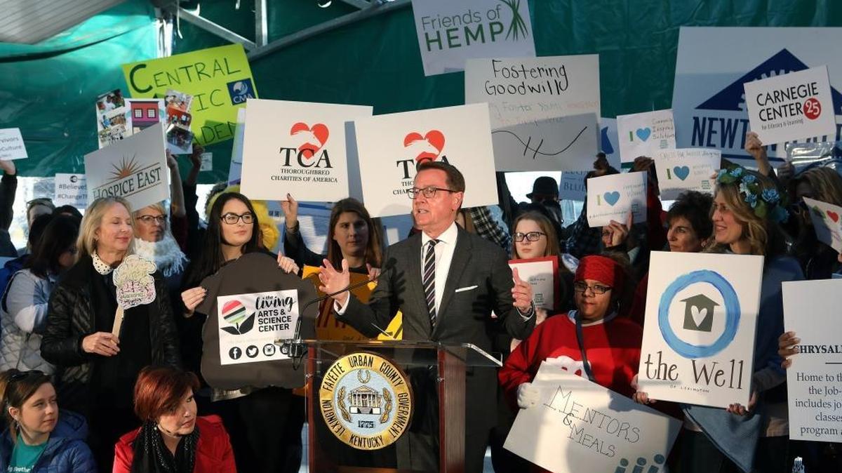 Mayor Jim Gray speaks during a news conference to kick off the annual GoodGiving Challenge to benefit 121 area charities, many of which were represented by signs held around the mayor at Fifth Third Pavilion in Lexington, Ky., Tuesday, November 28, 2017.