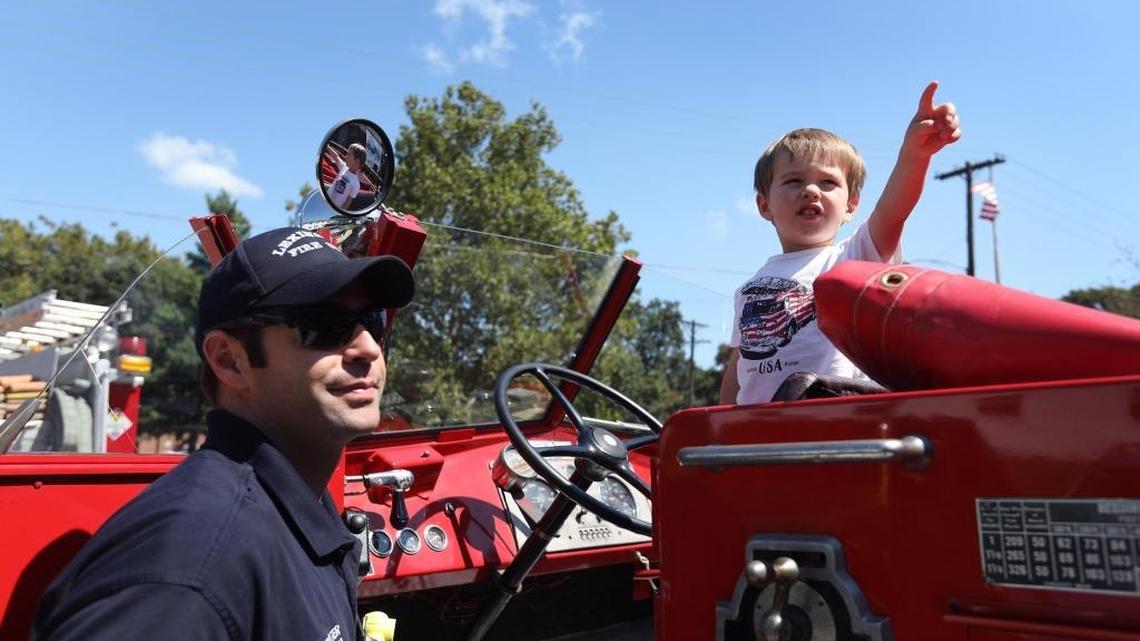 Barrett Wilson, 2, checked out Engine 6, also known as the Mayor’s truck, with his firefighter dad Ryan Wilson. Sunday was the the centennial celebration for Lexington’s Station 6 on South Limestone.