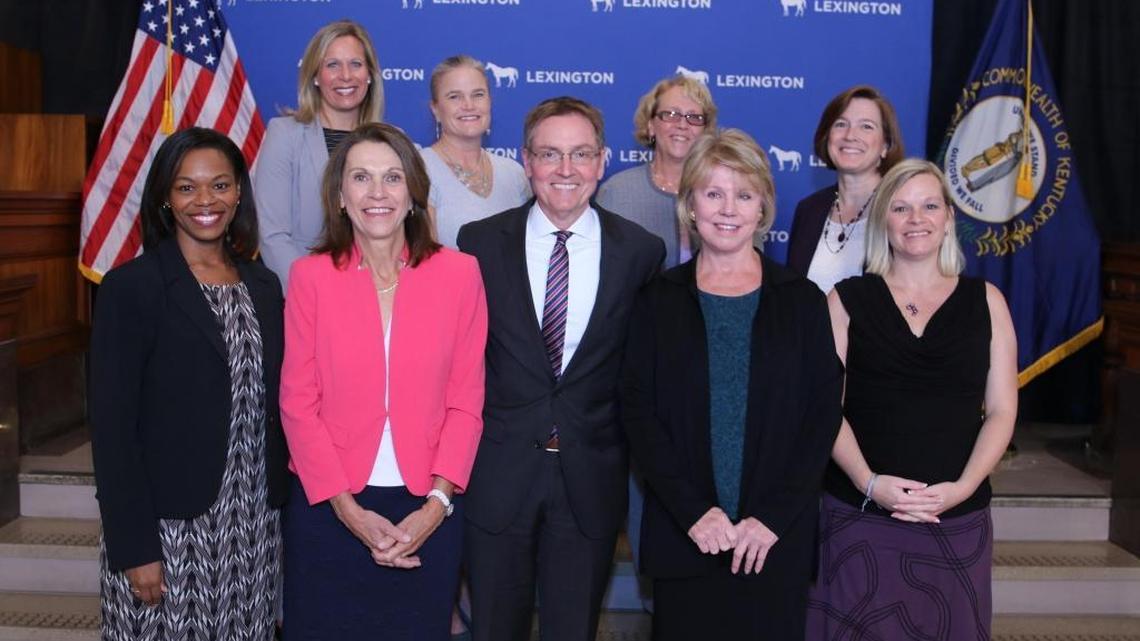 Lexington Mayor Jim Gray and the city's eight female council members posed for a photograph at the Government Center in downtown Lexington Wednesday. Front row (left to right): Angela Evans, Jennifer Mossotti, Mayor Gray, Kathy Plomin, Shevawn Akers. Back row (left to right): Amanda Bledsoe, Jennifer Scutchfield, Peggy Henson, Susan Lamb.