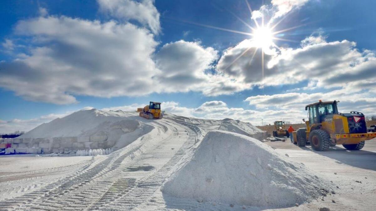 Daniel Petersen operated a track loader and Darren Lizer operated a front-end loader as they worked on a salt pile Tuesday at the Lexington-Fayette Urban County Government’s salt storage center on Old Frankfort Pike. The center received 1,000 tons of road salt Tuesday.  Both men work for the Division of Streets and Roads.