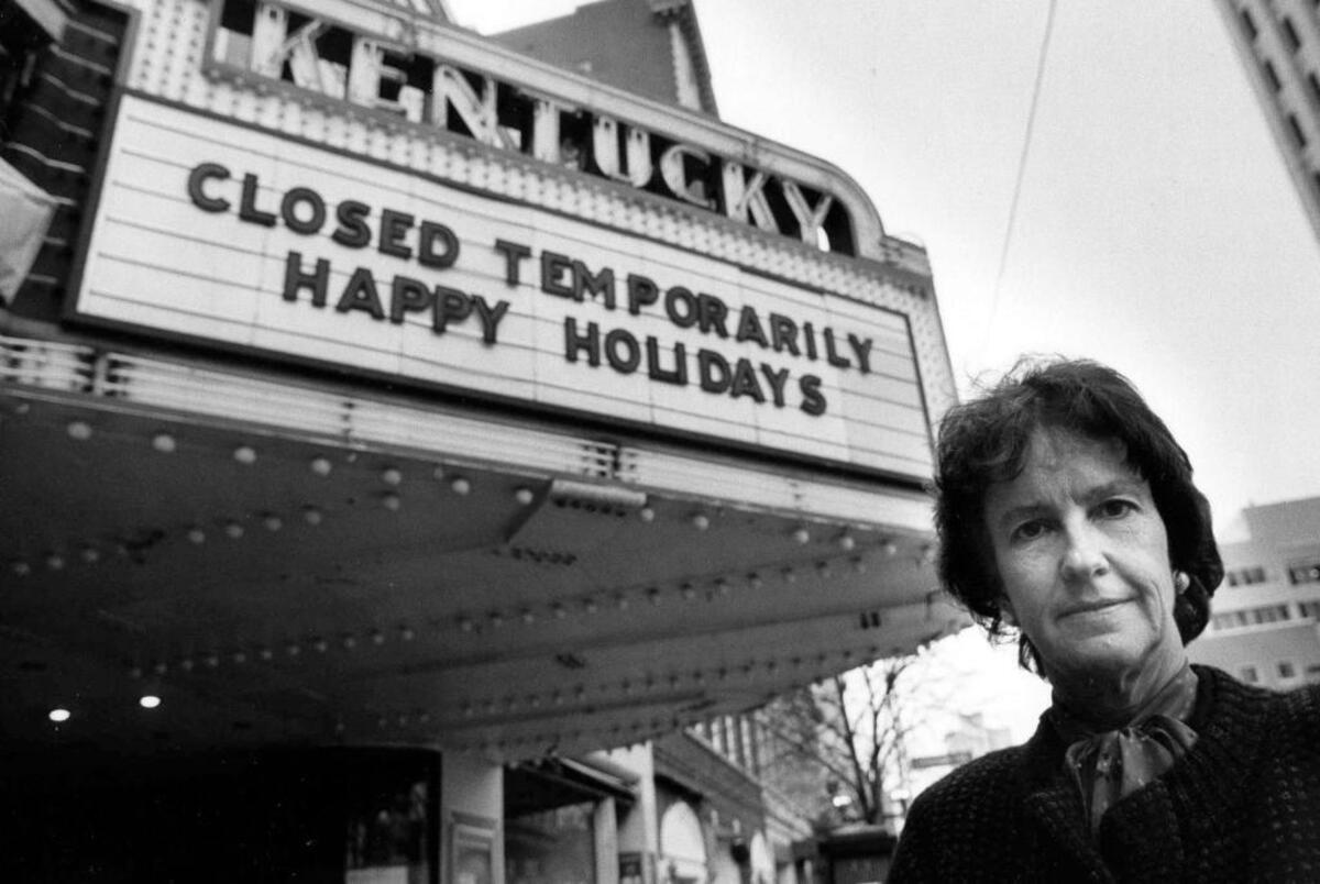 Mayor Pam Miller stands in front of the Kentucky Theatre, Dec. 30, 1987. The downtown Lexington landmark was closed because of a fire. Miller and the city helped secure funding to have the theater rebuilt.