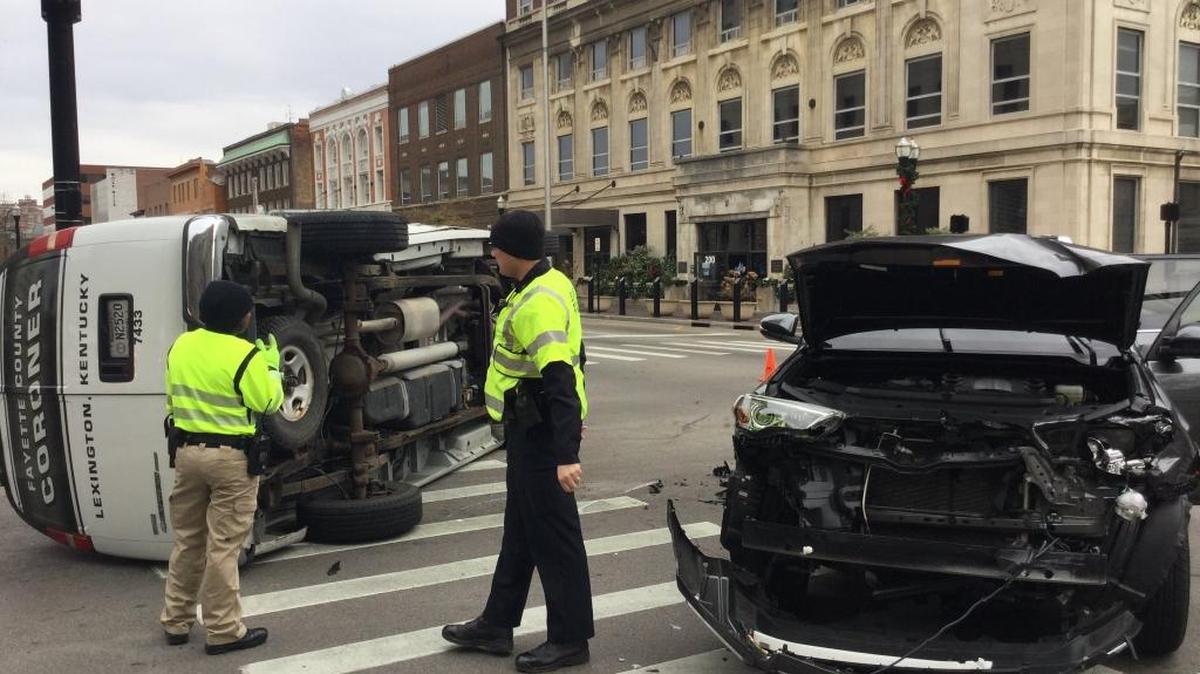 A crash Friday afternoon on Main Street caused a van belonging to the Fayette County Coroner’s Office to overturn.