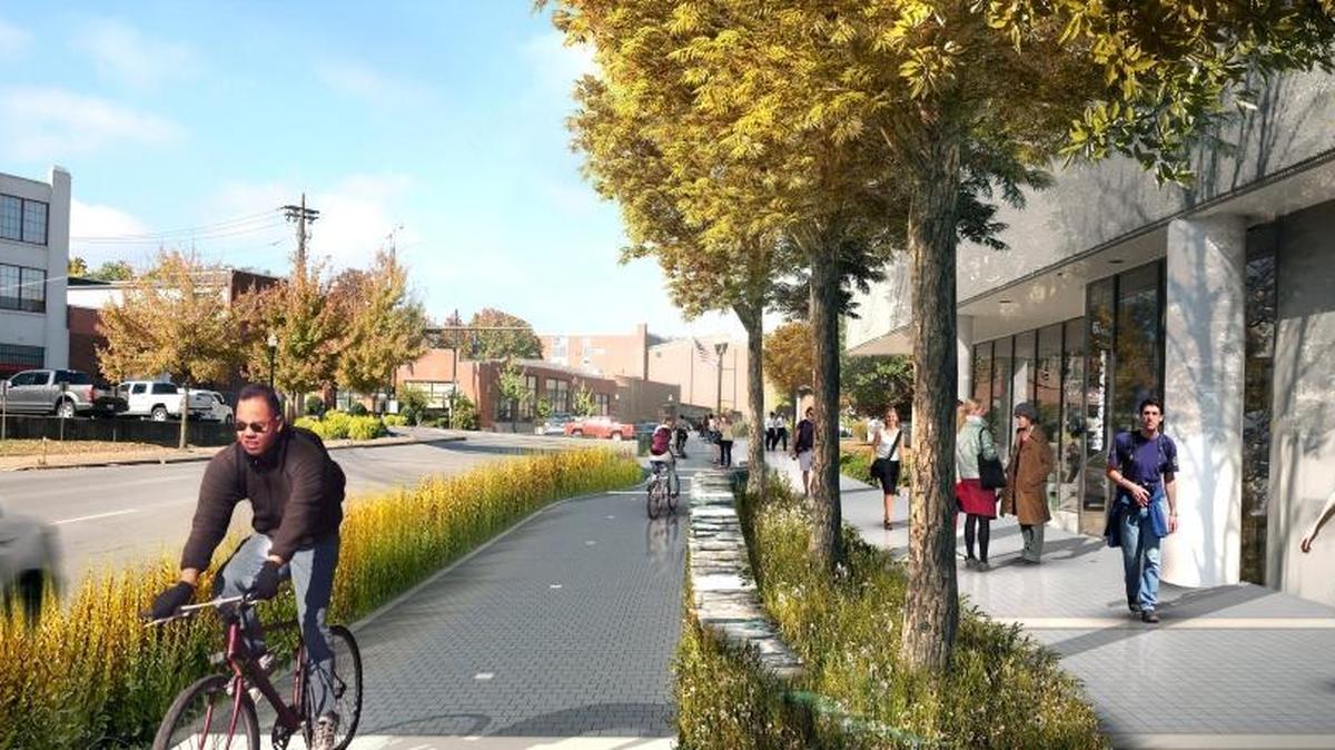 After rendering of a section of Town Branch Commons along Vine Street in downtown Lexington, featuring an urban trail and separate bike lane with trees and shrubs that will dot the trail.