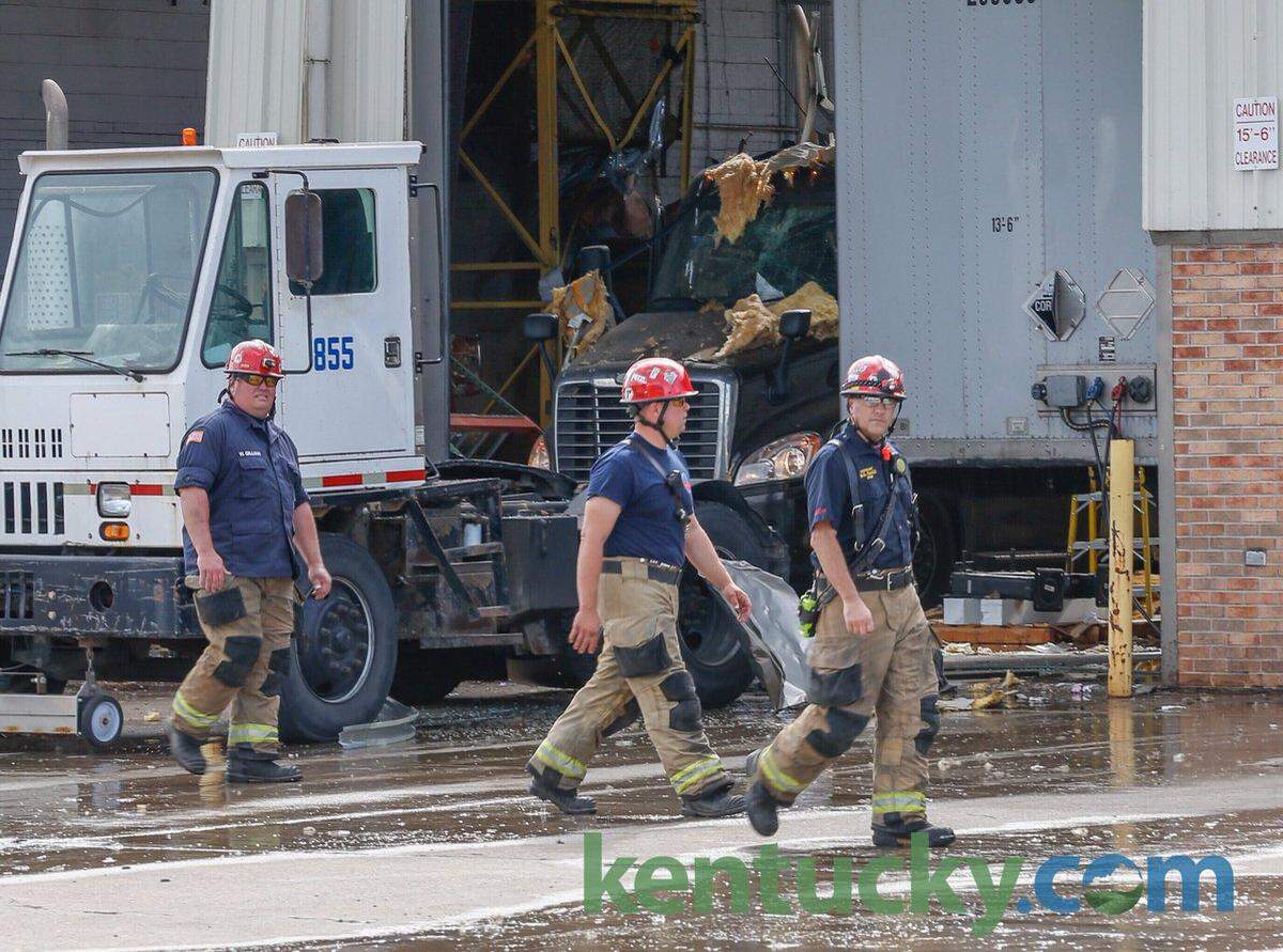 Blast damage to a truck and equipment in the UPS freight service center was visible as Lexington firefighters worked at the scene of the explosion Wednesday.