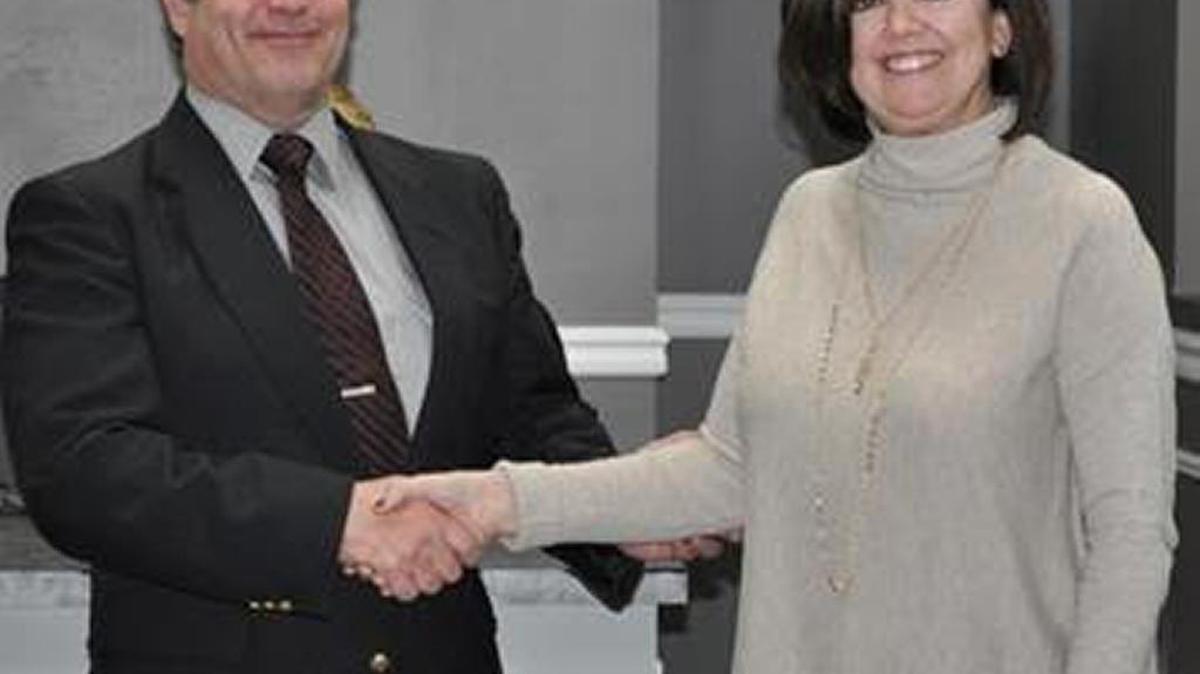Beth Brock, right, a Madison County School Board member, thanked Rick Goetz, Bechtel Parsons Blue Grass deputy project manager, for $10,000 in grants.