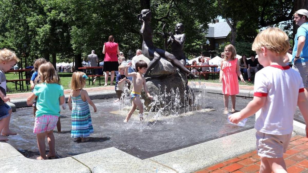 Children cooled off in the fountain during Mayfest at Gratz Park in Lexington. Sunday was the final day of the event, which features art vendors as well as local food and entertainment.