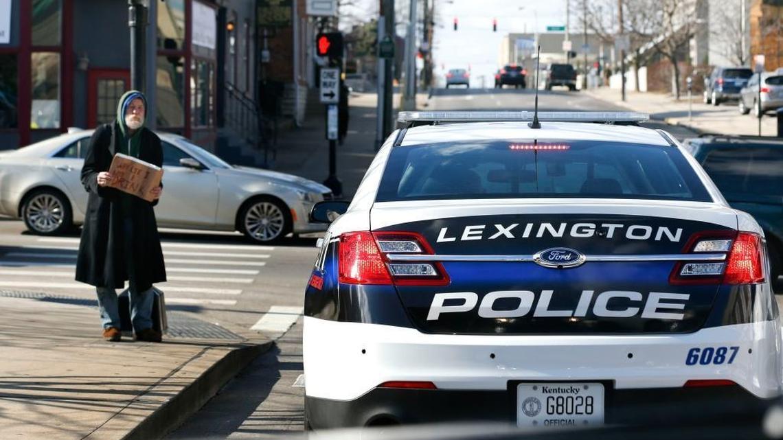 A man held a sign saying “why lie I need a drink” at East High Street and South Limestone. Since Lexington’s ordinance prohibiting panhandling was struck down by the state Supreme Court, the number of panhandlers has ballooned.