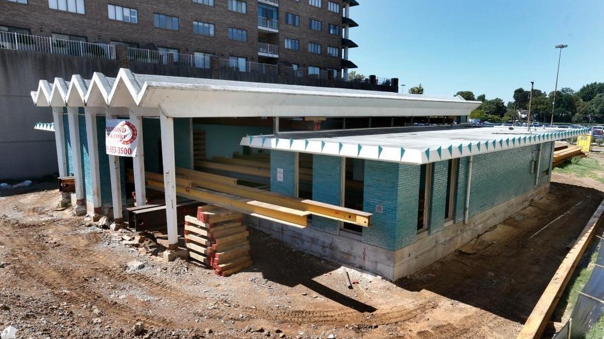 The former Peoples Bank building on South Broadway in Lexington was supposed to be moved across the Rupp Arena parking lot to make way for a 12-screen movie theater complex, but the move has been delayed indefinitely. Steel beams had been placed inside the building for the move.