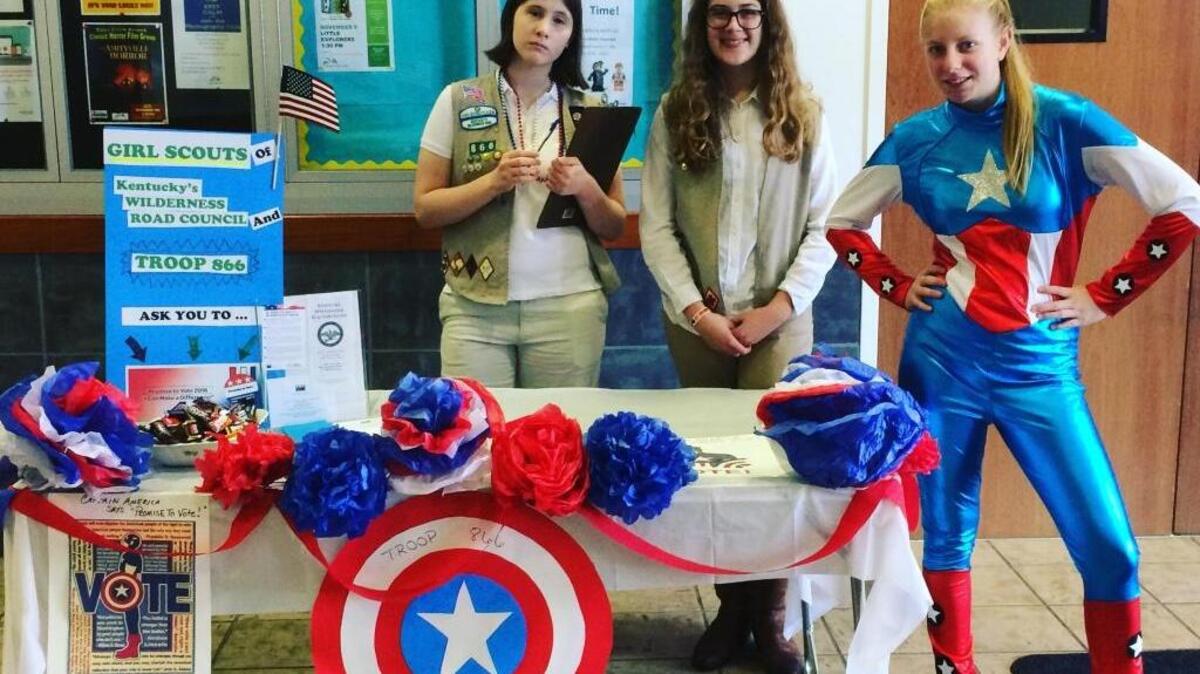 Girl Scout Troop 866 members, from left, Rosemary Carruthers of Henry Clay High School, and Riley Day and Lilly Hogan of Tates Creek High School, participated in their Captain America-themed booth at Tates Creek Library recently for Promise To Vote. Girl Scouts of the Wilderness Road Council and other councils across the U.S. participated in activities to remind voters to go to the polls on Nov. 8 and vote. Girls also participated in voter registration drives and awareness activities this fall during the Promise To Vote campaign.