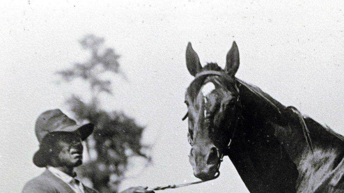 John Henry Buckner is shown with Man o' War in this 1920s photo taken near Lexington.