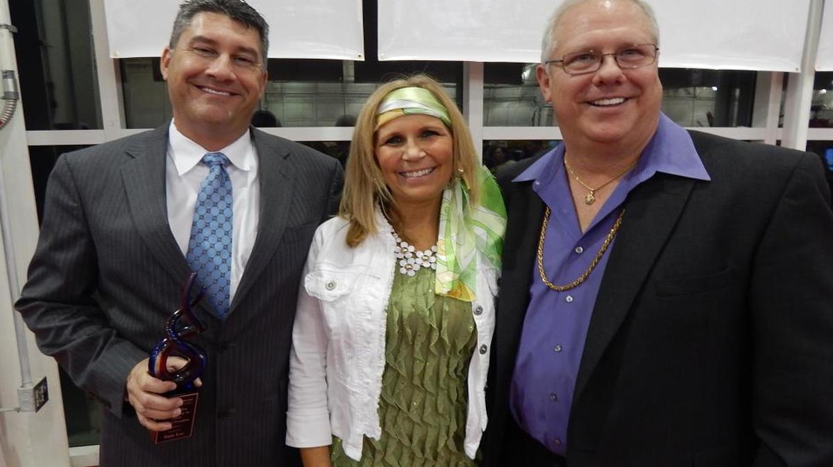 Jessamine County Chamber of Commerce outgoing president Sam Lee, left, with executive director Ronda May and newly installed president Randall Chewning at the annual meeting and awards dinner held at the R.J. Corman Hangar.