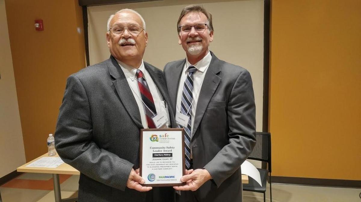 Nicholasville Police Chief Barry Waldrop, left, accepted the Community Safety Leader award from Jessamine County Public Health Director Randy Gooch.