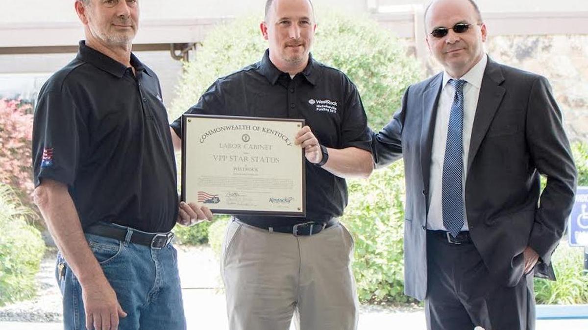 From left, WestRock Nicholasville employees Gary Chapman, reliability lead, and Jeff Clark, safety and environmental coordinator, were congratulated by Ervin Dimeny, commissioner of the Kentucky Department of Workplace Standards, for receiving the OSHA Voluntary Protection Program Certification.
